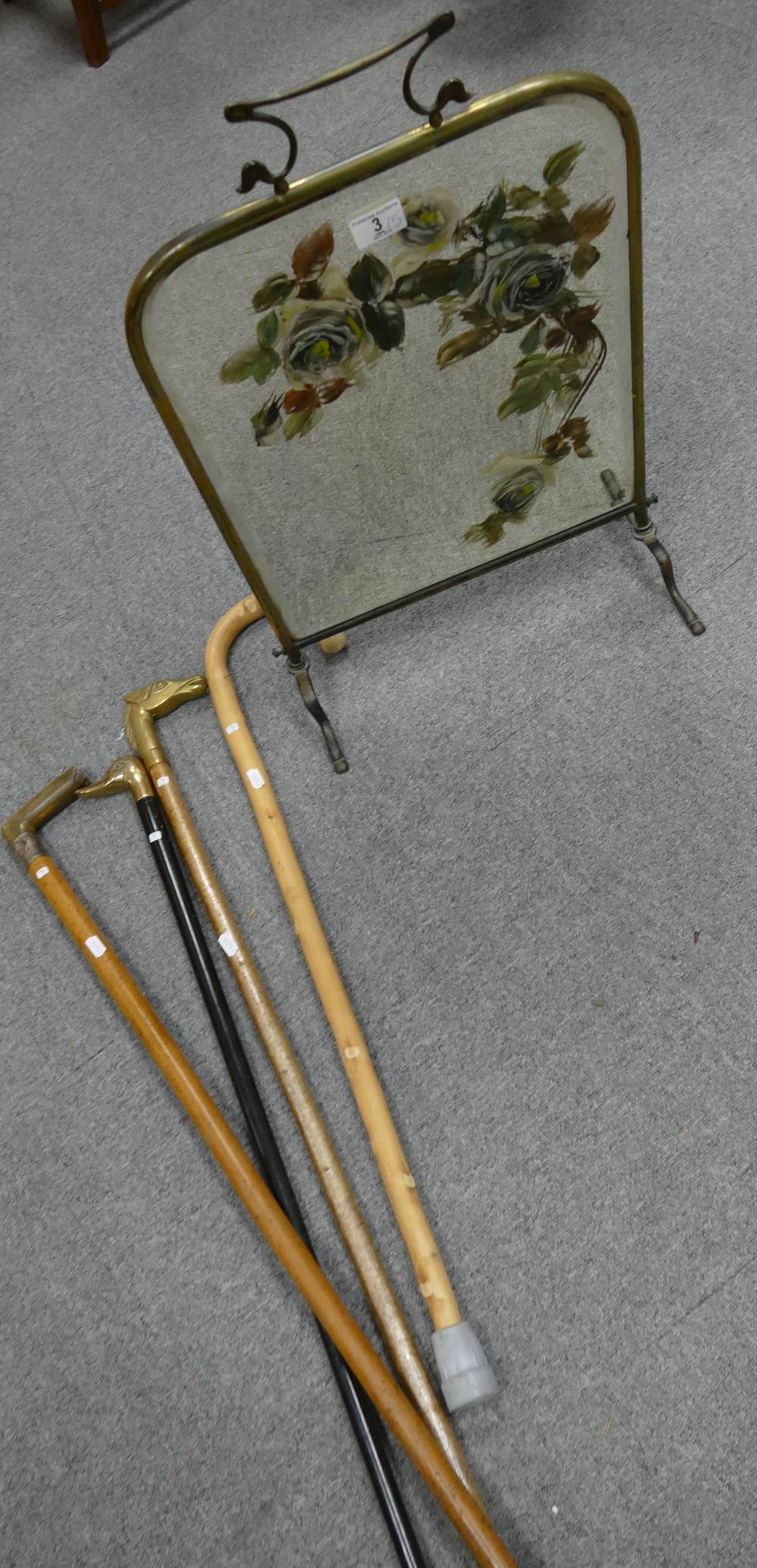 4 walking sticks, one with silver handle bounding,