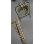 4 walking sticks, one with silver handle bounding,