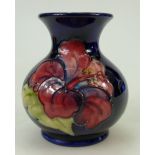 Moorcroft small vase decorated in the hibiscus design, height 9.