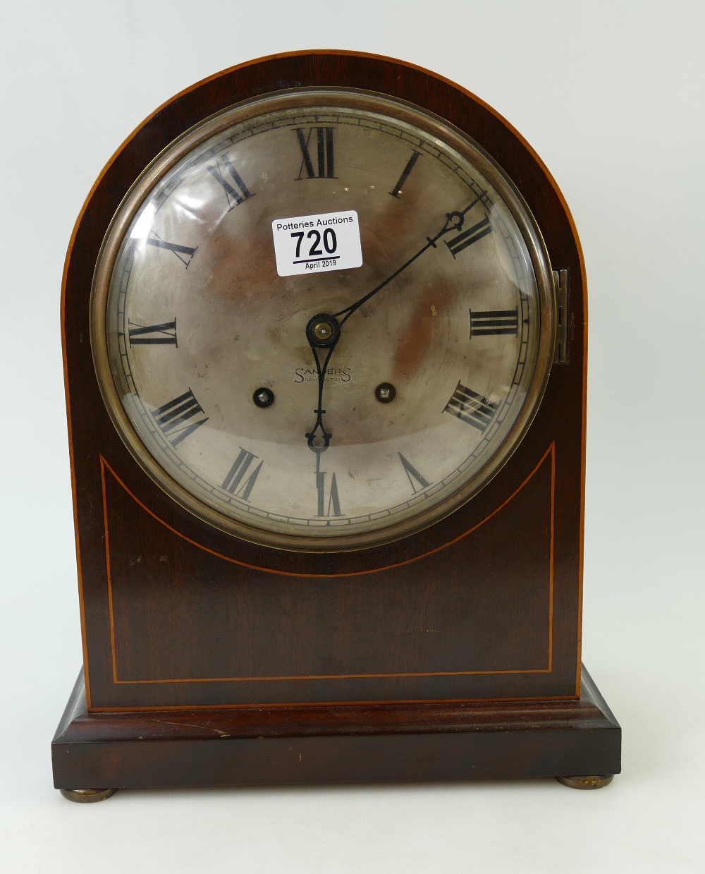 Large mahogany dome top mantle clock, retailed by Sanders Kensington. Nice quality movement.