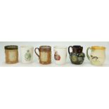 A collection of Royal Doulton mugs and jugs: Items including Lambeth King George Coronation mugs,