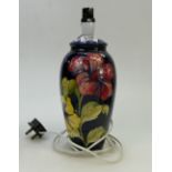 Moorcroft lamp: Moorcroft lamp, hibiscus on blue ground pattern. Crazing to top section.