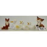 Three ceramic items: Beswick Comical Fox 1733, Seated Fox 1748 and comical duck family 765.