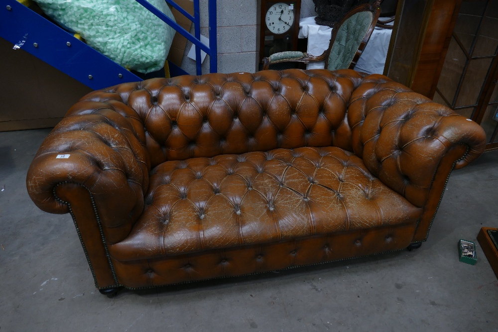 Chesterfield Settee: Chestnut brown leather Chesterfield settee