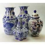 Four Modern Oriental style vases: Height of tallest vase 36cm.