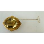 Vintage 9ct gold ornate brooch with large oval stone, 19.