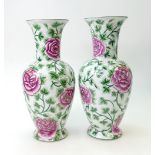 Pair Chinese porcelain vases: decorated with pink flowers,red factory marks to base,