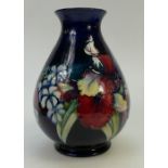 Moorcroft Orchid and Wildflowers Vase: Vase height approx 22cm.