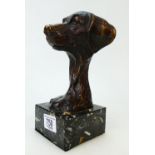 Bronzed figural dogs head: Bronzed dogs head on marble effect stand.