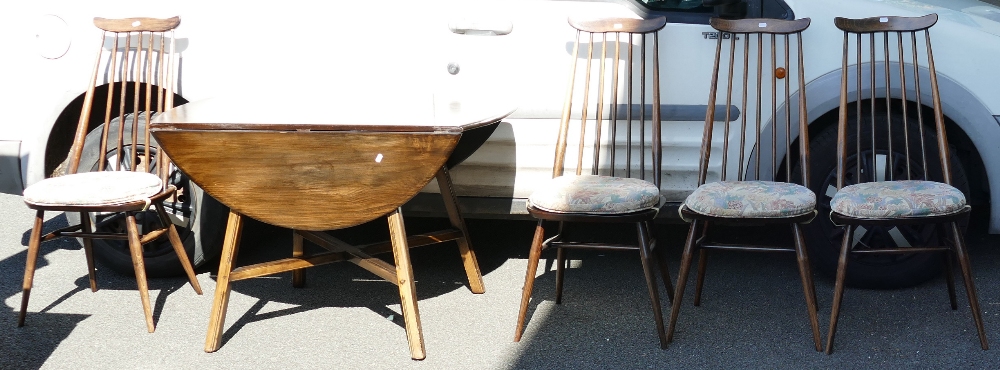 Ercol Furniture: Dark brown Windsor style table & chairs, with original cushions.