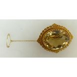 Vintage 9ct gold ornate brooch with large oval stone, 19.