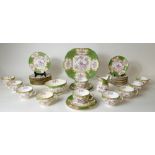 Minton tea set in the Cockatrice design: Set consisting of 11 saucers, 11 side plates,