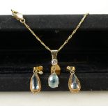 9ct gold necklace, pendant and earrings set: Set with Aquamarine blue stones, gross weight 5.