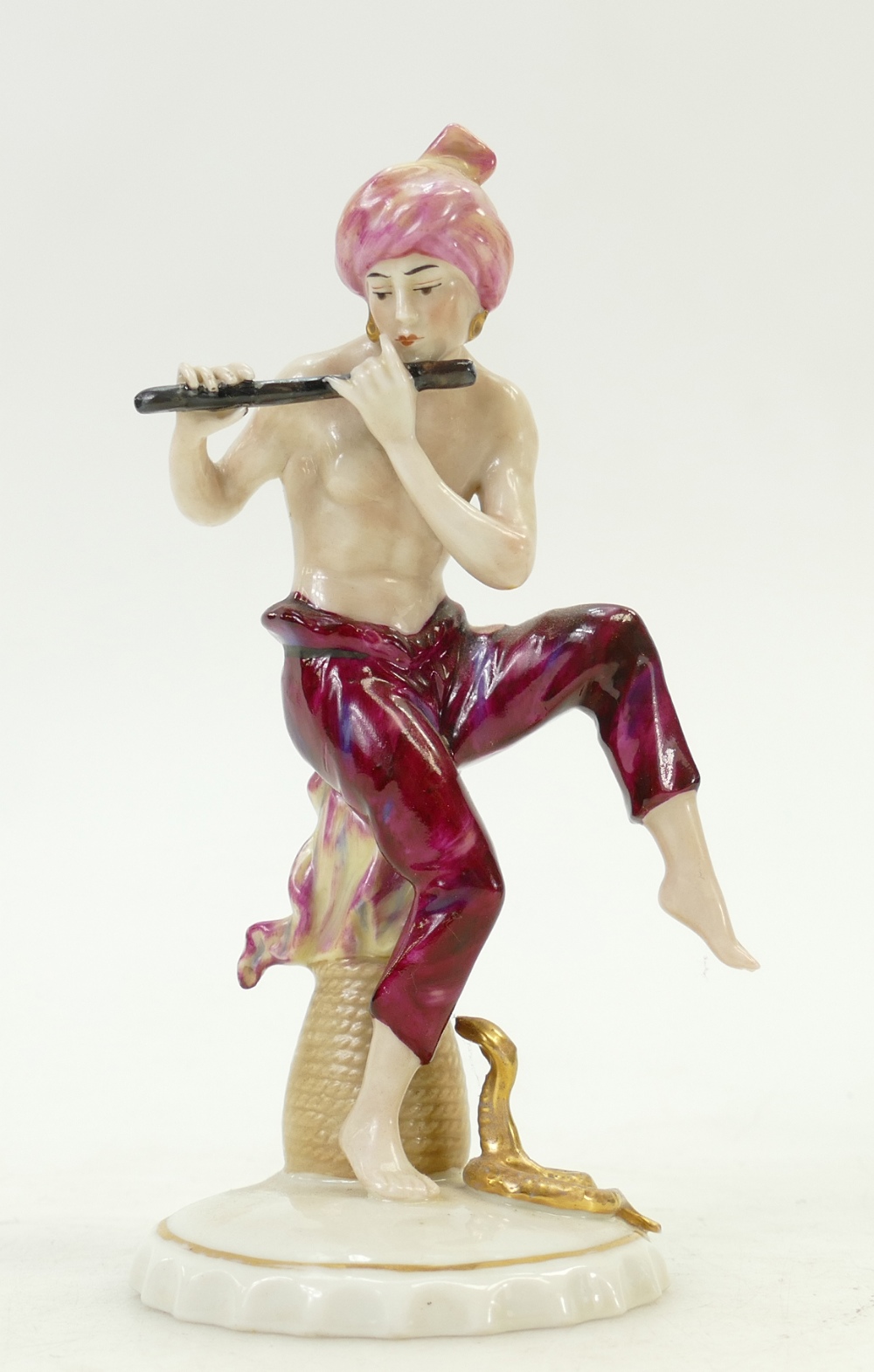 Sitzendorf porcelain figure of a snake charmer: Figure playing the flute, c1930s, height 16cm.