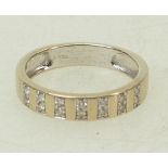 18ct white gold ladies wedding ring / band: Ring set with .14ct, size M/N, 3.2grams.