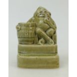 Doulton Lambeth Stoneware figure of a seated man with barrel smoking pipe: Stoneware figure by