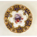 Royal Worcester cabinet plate: A gilded and hand painted plate with fruit by Cole, diameter 22.5cm.