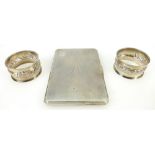 Silver cigarette case and pair silver serviette rings: Silver items weighing 227 grams.