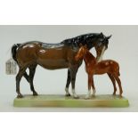 A Beswick model of a brown Mare and chestnut Foal: Beswick No 1811 on a rectangular base.