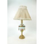 Gilt bronze & porcelain lamp: Lamp complete with original shade (a/f) and fittings.