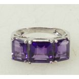 9ct white gold three stone Amethyst ring: Ring size N/O, 4.5 grams.