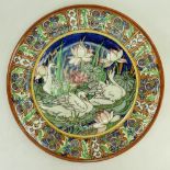 Burgess & Leigh Charlotte Rhead charger: Charger decorated with three swans on a pond with lilies,