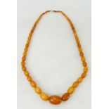Amber beads: A string of butterscotch amber beads, weight 61g.