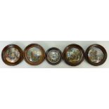 A collection of Prattware circular pot lids in oak frames: Pot lids comprising - Hide and Seek,