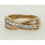9ct gold Crossover dress ring: Ring set with CZ stones, size K, 3.6grams.