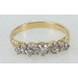 18ct gold ring: Ring set with five diamonds, size N/O, 3.6 grams.
