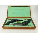 Pair of replica Pistols in wood case: Pistols in case, marked JMC model 1974.