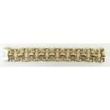 14ct .585 large decorative designer bracelet, weighing 63.1 grams: Bracelet measures 27mm deep x 19.