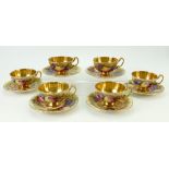 A collection of Aynsley gilded tea cups and saucers: Aynsley cups and saucers decorated with