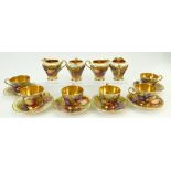 A collection of Aynsley gilded coffee cups and saucers: Aynsley cups and saucers decorated with