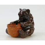 Doulton Lambeth stoneware model of a seated bear: Stoneware seated bear holding a honey pot,