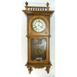 Early 20th century French Walnut Vienna Wall Clock: Vienna clock with Art Nouveau panels to top