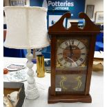 Mid century wooden 21 day Mantle Clock: Mantle Clock together with a resin table lamp.