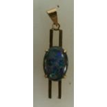 10ct gold opal pendant: 10K gold pendant set with oval blue opal stone, 4.1 grams.