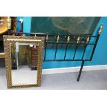 Bevel Edged Wall Mirror: in gilt frame together with modern metal and brass headboard(2)