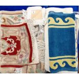 A collection of 4 small rugs / runners : varying colours