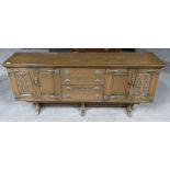 Mid Century Arts and Crafts Style carved oak sideboard: 4 door, 4 drawer in construction,