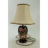 Moorcroft lamp base: on wooden base decorated in the Oberon design with original factory shade