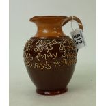 Royal Doulton stoneware jug: Doulton stoneware motto jug 'he who buys land..... Standing 14cm high.