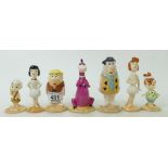 A collection Beswick Flintstones figures: Fred and Wilma, Pebbles Flinstone, Barney and Betty,