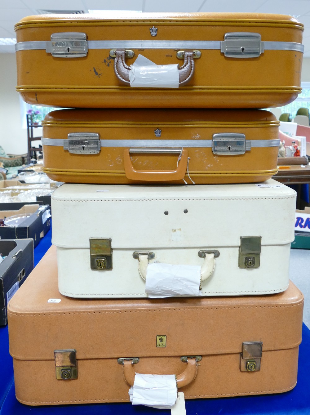 A collection of 4 vintage suitcases: browns and cream in colour(4)