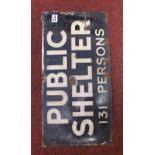 A vintage black and white Public Shelter sign: 131 persons