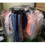 A large quantity of Klass ladies clothing: to include trousers, dresses, tops, skirts etc 1 rack