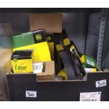 A large quntity of John Deere tractor parts: to include maintence packs, oil filters, belts etc