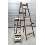 Vintage set of pine ladders together with larger similar item.