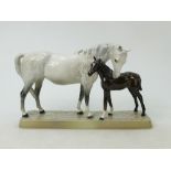 Beswick Mare and Foal on base: Beswick grey mare with dark brown foal on ceramic grass base model